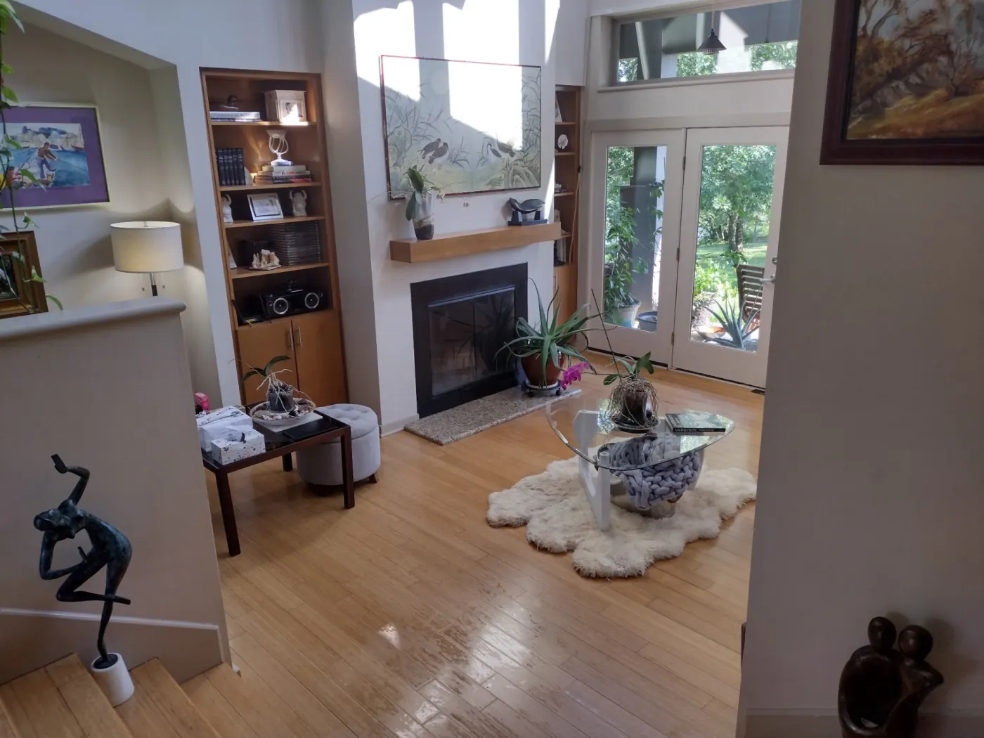 Tidy living room with hardwood floors and clean fireplace in Hot Springs Arkansas