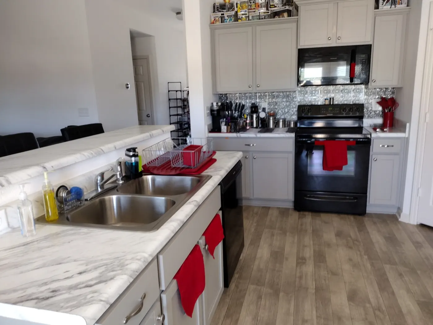 Bright kitchen with cleaned stainless sink, countertops and stove in Hot Springs Arkansas
